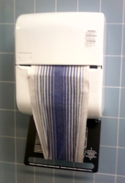 (This is something like what that towel dispenser must have looked like ... before someone took a baseball bat to it.)